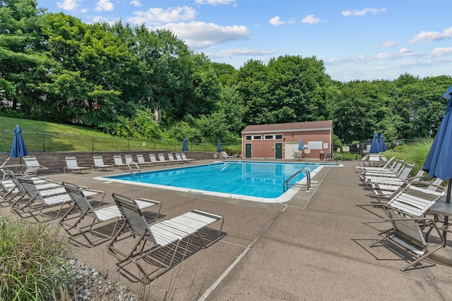 79 Meadow Way, Hopewell Junction, NY 12533 - community pool featuring a patio and an outbuilding