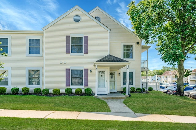 77 Fairview Cir Unit 77, Middle Island, NY 11953 - townhome / multi-family property with a front lawn and a balcony