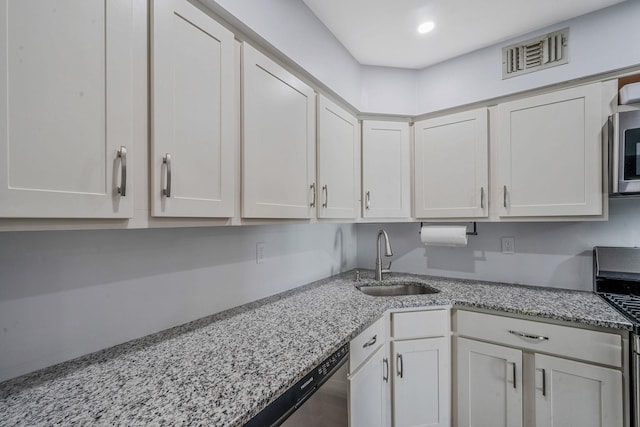 77 Fairview Cir Unit 77, Middle Island, NY 11953 - kitchen with white cabinets, stainless steel appliances, light stone counters, and recessed lighting