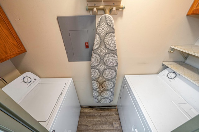 77 Fairview Cir Unit 77, Middle Island, NY 11953 - laundry room featuring electric panel, washing machine and dryer, and cabinet space