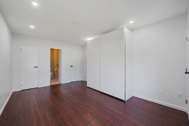 77 Fairview Cir Unit 77, Middle Island, NY 11953 - unfurnished bedroom featuring wood finished floors, recessed lighting, and ensuite bath