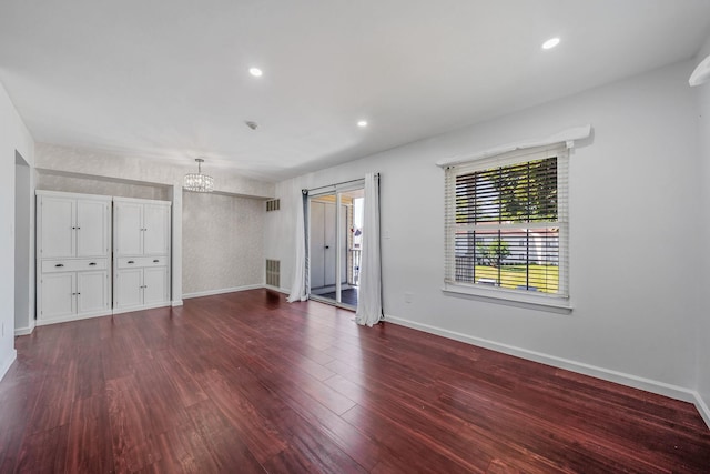 77 Fairview Cir Unit 77, Middle Island, NY 11953 - unfurnished bedroom featuring a chandelier, access to outside, dark wood-style flooring, and recessed lighting