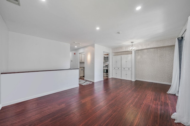 77 Fairview Cir Unit 77, Middle Island, NY 11953 - unfurnished room with wood finished floors, a chandelier, and recessed lighting