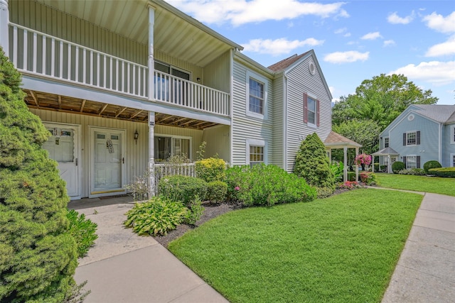 276 Fairview Cir, Middle Island, NY 11953 - view of front of home with a front yard, a balcony, and a porch