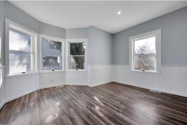 178 N Ocean Ave, Patchogue, NY 11772 - unfurnished room with a wainscoted wall, dark wood-style floors, and recessed lighting