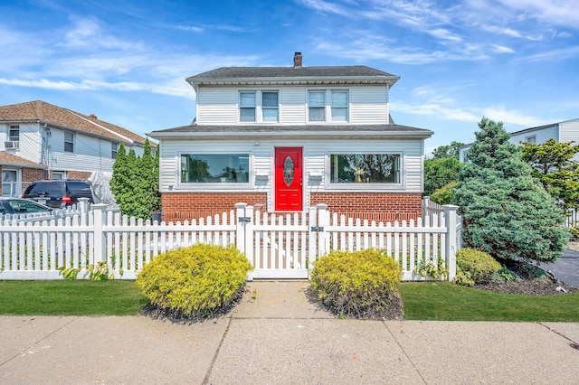 557 Newbridge Rd, East Meadow, NY 11554 - american foursquare style home featuring brick siding, a chimney, a fenced front yard, and a gate