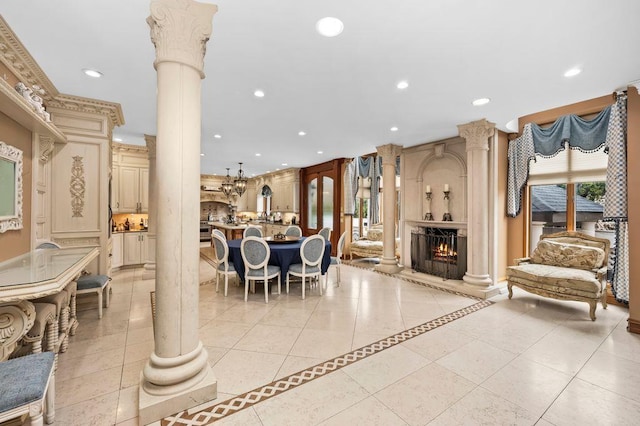 35 Jeffrey Pl, Staten Island, NY 10307 - dining space with decorative columns, recessed lighting, a large fireplace, light tile patterned floors, and inlaid floor details