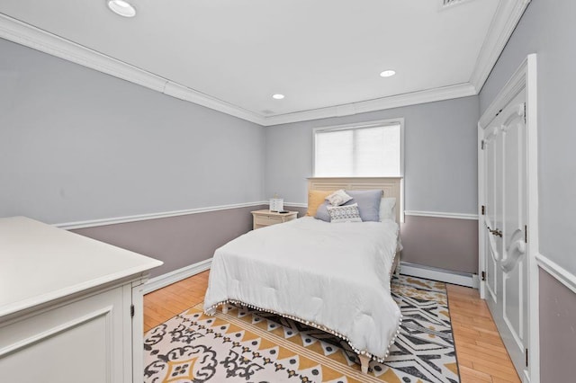 35 Jeffrey Pl, Staten Island, NY 10307 - bedroom featuring a baseboard radiator, crown molding, recessed lighting, and light wood-style flooring