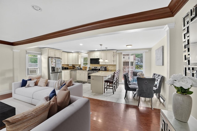 98 N Evarts Ave, Elmsford, NY 10523 - living room featuring ornamental molding, healthy amount of natural light, light wood-style flooring, and recessed lighting