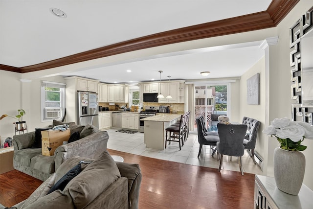 98 N Evarts Ave, Elmsford, NY 10523 - living area with ornamental molding, recessed lighting, light wood finished floors, cooling unit, and baseboard heating