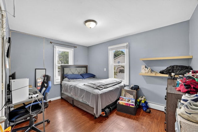 98 N Evarts Ave, Elmsford, NY 10523 - bedroom featuring multiple windows, wood finished floors, and an office area