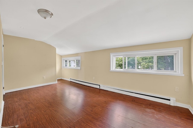 98 N Evarts Ave, Elmsford, NY 10523 - empty room with a baseboard radiator, wood finished floors, and vaulted ceiling