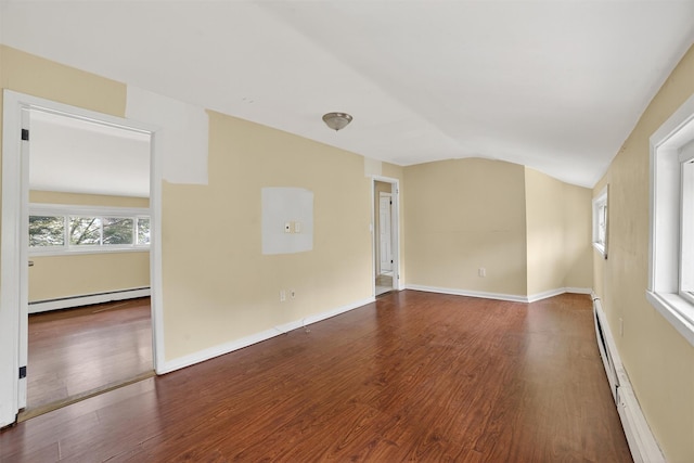 98 N Evarts Ave, Elmsford, NY 10523 - spare room with baseboard heating, a baseboard radiator, lofted ceiling, and wood finished floors