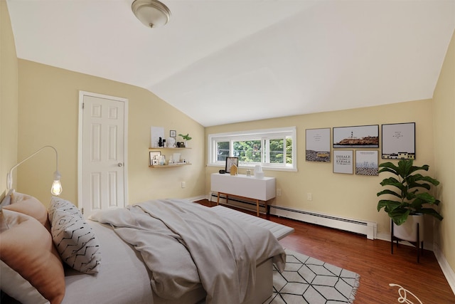 98 N Evarts Ave, Elmsford, NY 10523 - bedroom featuring vaulted ceiling, a baseboard radiator, and wood finished floors