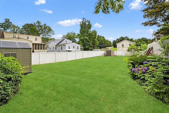 98 N Evarts Ave, Elmsford, NY 10523 - fenced backyard featuring a storage unit and a residential view