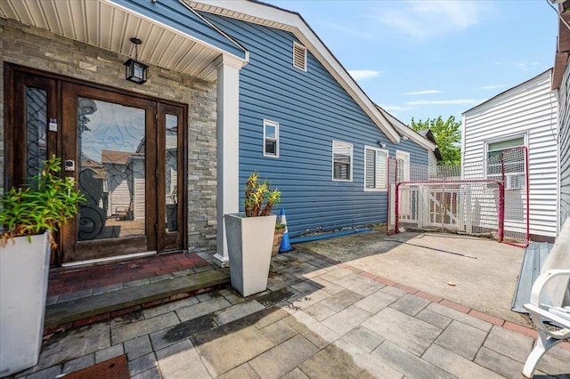 137 Jefferson St, Inwood, NY 11096 - view of exterior entry with stone siding
