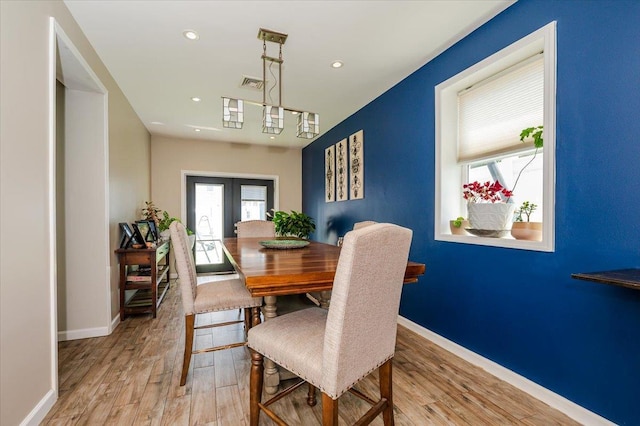 137 Jefferson St, Inwood, NY 11096 - dining space featuring light wood-type flooring, healthy amount of natural light, french doors, and recessed lighting