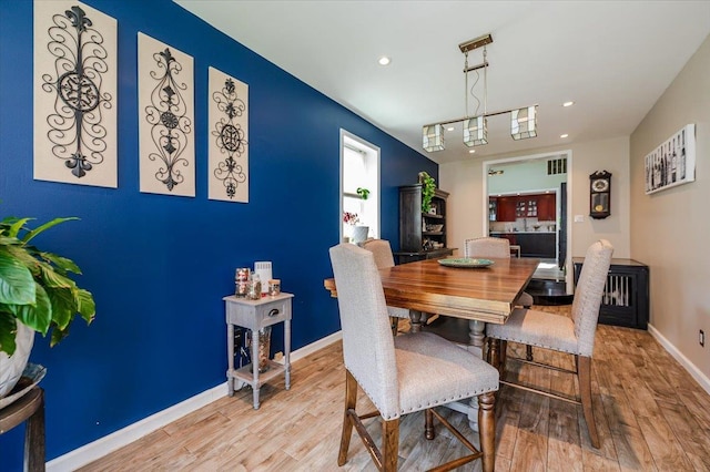 137 Jefferson St, Inwood, NY 11096 - dining room with wood finished floors and recessed lighting