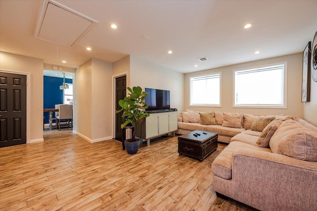 137 Jefferson St, Inwood, NY 11096 - living room with attic access, light wood-style flooring, and recessed lighting