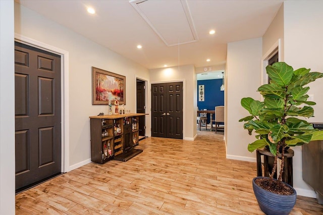 137 Jefferson St, Inwood, NY 11096 - foyer with light wood finished floors and recessed lighting