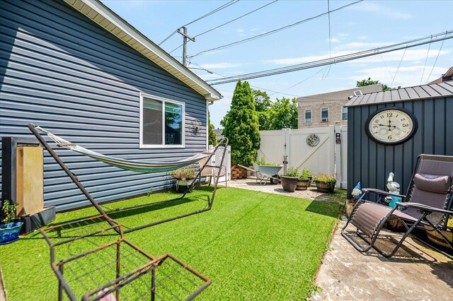 137 Jefferson St, Inwood, NY 11096 - fenced backyard with a gate and a patio