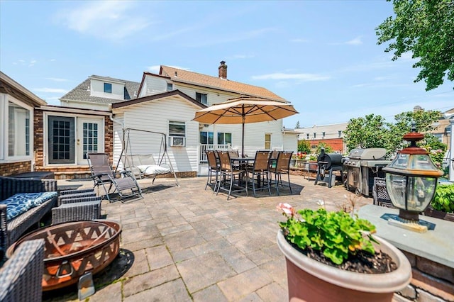 137 Jefferson St, Inwood, NY 11096 - view of patio / terrace with a grill, outdoor dining space, and an outdoor fire pit