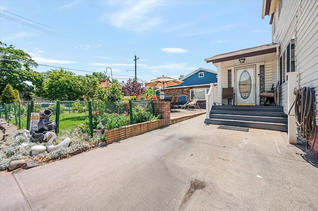 137 Jefferson St, Inwood, NY 11096 - view of concrete driveway with street lights