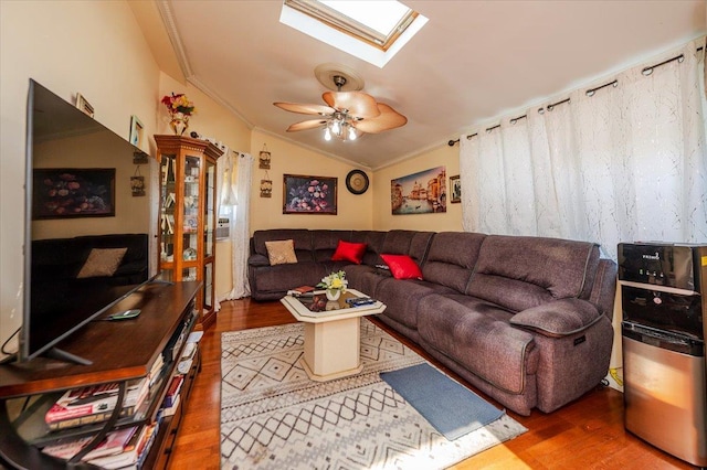 137 Jefferson St, Inwood, NY 11096 - living area with crown molding, wood finished floors, a skylight, ceiling fan, and vaulted ceiling