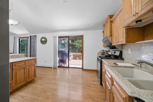 49 Raker Rd, Poughkeepsie, NY 12603 - kitchen with stainless steel range with gas cooktop, light wood-type flooring, baseboard heating, light stone countertops, and decorative backsplash
