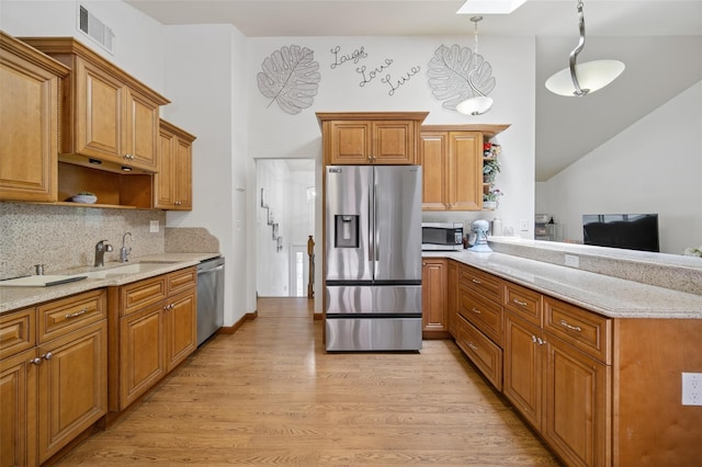 49 Raker Rd, Poughkeepsie, NY 12603 - kitchen featuring stainless steel appliances, open shelves, brown cabinets, a peninsula, and high vaulted ceiling