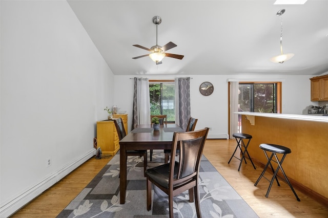 49 Raker Rd, Poughkeepsie, NY 12603 - dining space with a baseboard heating unit, light wood finished floors, lofted ceiling, and a ceiling fan