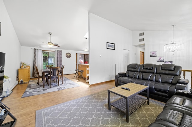 49 Raker Rd, Poughkeepsie, NY 12603 - living area with a ceiling fan, high vaulted ceiling, a chandelier, and wood finished floors