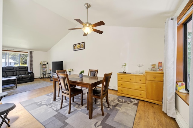 49 Raker Rd, Poughkeepsie, NY 12603 - dining area with light wood-type flooring, vaulted ceiling, and a ceiling fan