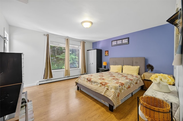 49 Raker Rd, Poughkeepsie, NY 12603 - bedroom with baseboard heating and wood finished floors