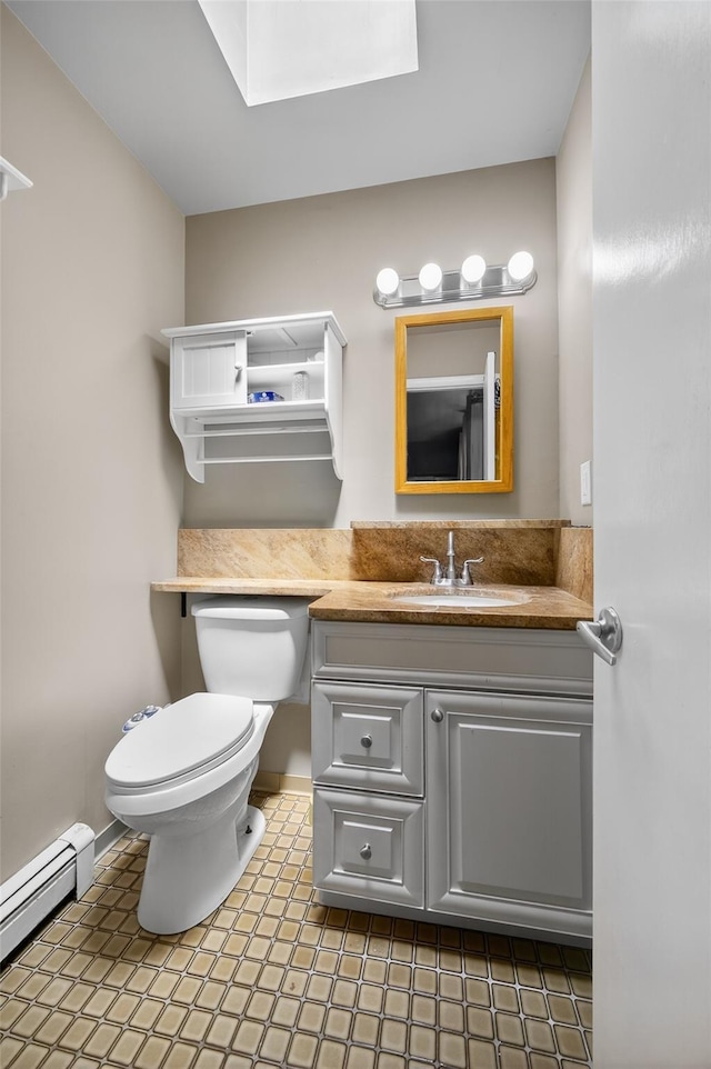 49 Raker Rd, Poughkeepsie, NY 12603 - bathroom with a baseboard radiator, vanity, and a skylight