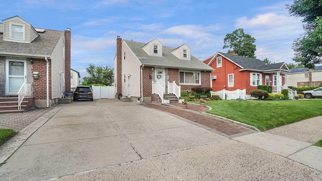 2334 Belmont Ave, Elmont, NY 11003 - cape cod home with entry steps, brick siding, driveway, and a shingled roof