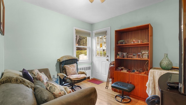 2334 Belmont Ave, Elmont, NY 11003 - sitting room with radiator and wood finished floors
