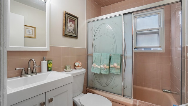 2334 Belmont Ave, Elmont, NY 11003 - full bath featuring shower / bath combination with glass door, vanity, and tile walls