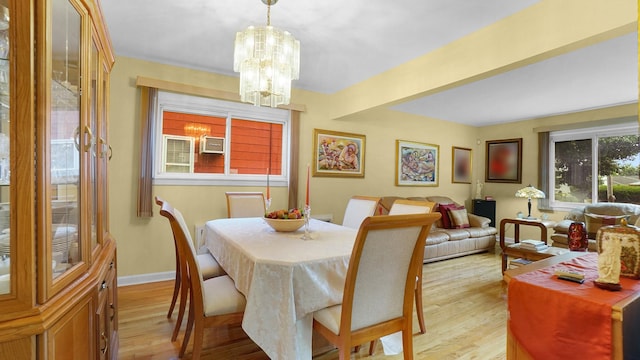 2334 Belmont Ave, Elmont, NY 11003 - dining room with light wood-style floors and a chandelier