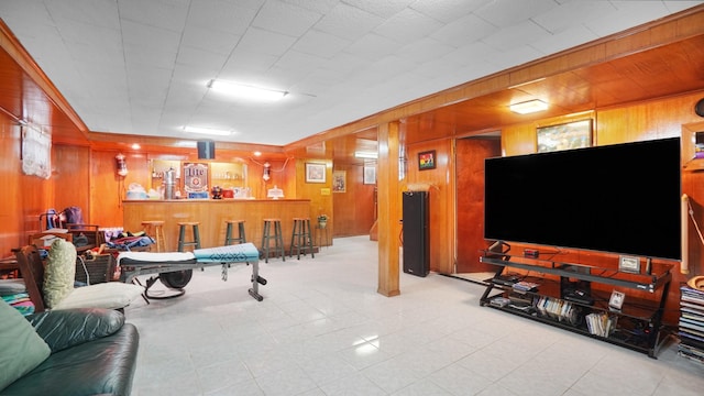 2334 Belmont Ave, Elmont, NY 11003 - living area featuring wood walls and a bar