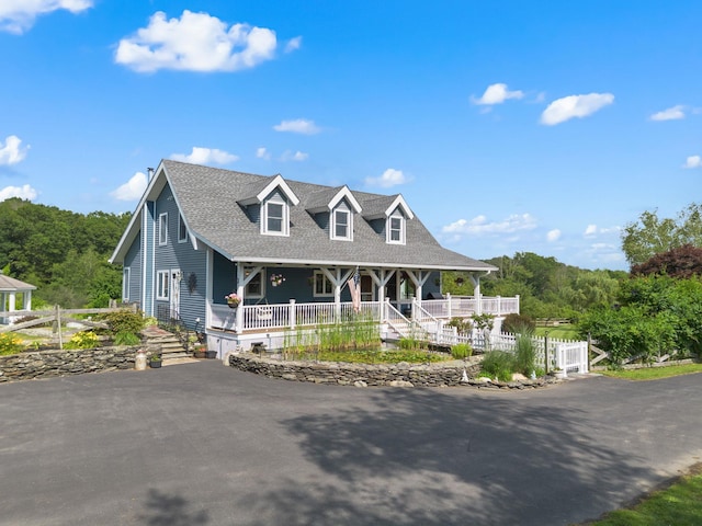 17 Conover Way, Lagrangeville, NY 12540 - view of front facade featuring covered porch, a shingled roof, and asphalt driveway