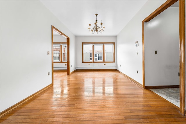 2162 24th St, Astoria, NY 11105 - spare room featuring light wood finished floors, a chandelier, and a baseboard radiator