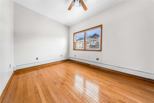 2162 24th St, Astoria, NY 11105 - unfurnished room with a ceiling fan, hardwood / wood-style flooring, and vaulted ceiling