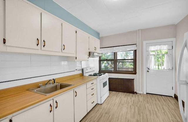 29 William St, Ossining, NY 10562 - kitchen featuring white appliances, light countertops, plenty of natural light, and white cabinetry