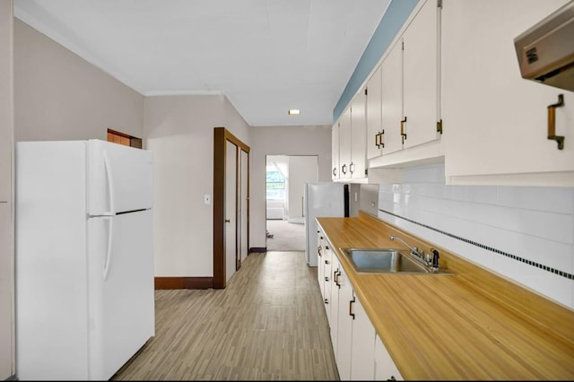 29 William St, Ossining, NY 10562 - kitchen featuring freestanding refrigerator, butcher block counters, tasteful backsplash, white cabinetry, and recessed lighting