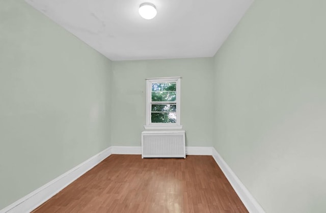 29 William St, Ossining, NY 10562 - empty room featuring radiator heating unit and wood finished floors
