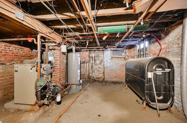 29 William St, Ossining, NY 10562 - unfinished below grade area with gas water heater, oil tank, brick wall, and a heating unit
