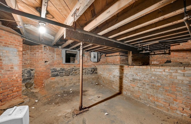 29 William St, Ossining, NY 10562 - unfinished below grade area with electric panel and brick wall