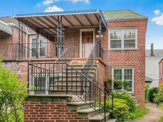 3227 Bruckner Blvd, Bronx, NY 10461 - view of front of house with brick siding and stairway