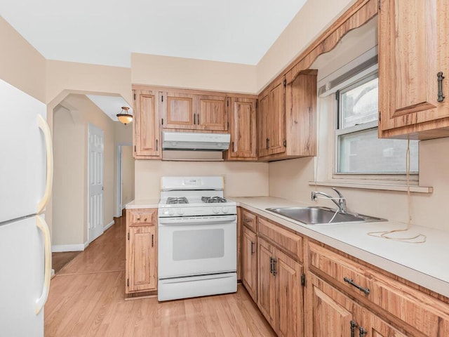 3227 Bruckner Blvd, Bronx, NY 10461 - kitchen featuring white appliances, under cabinet range hood, light countertops, and light wood finished floors